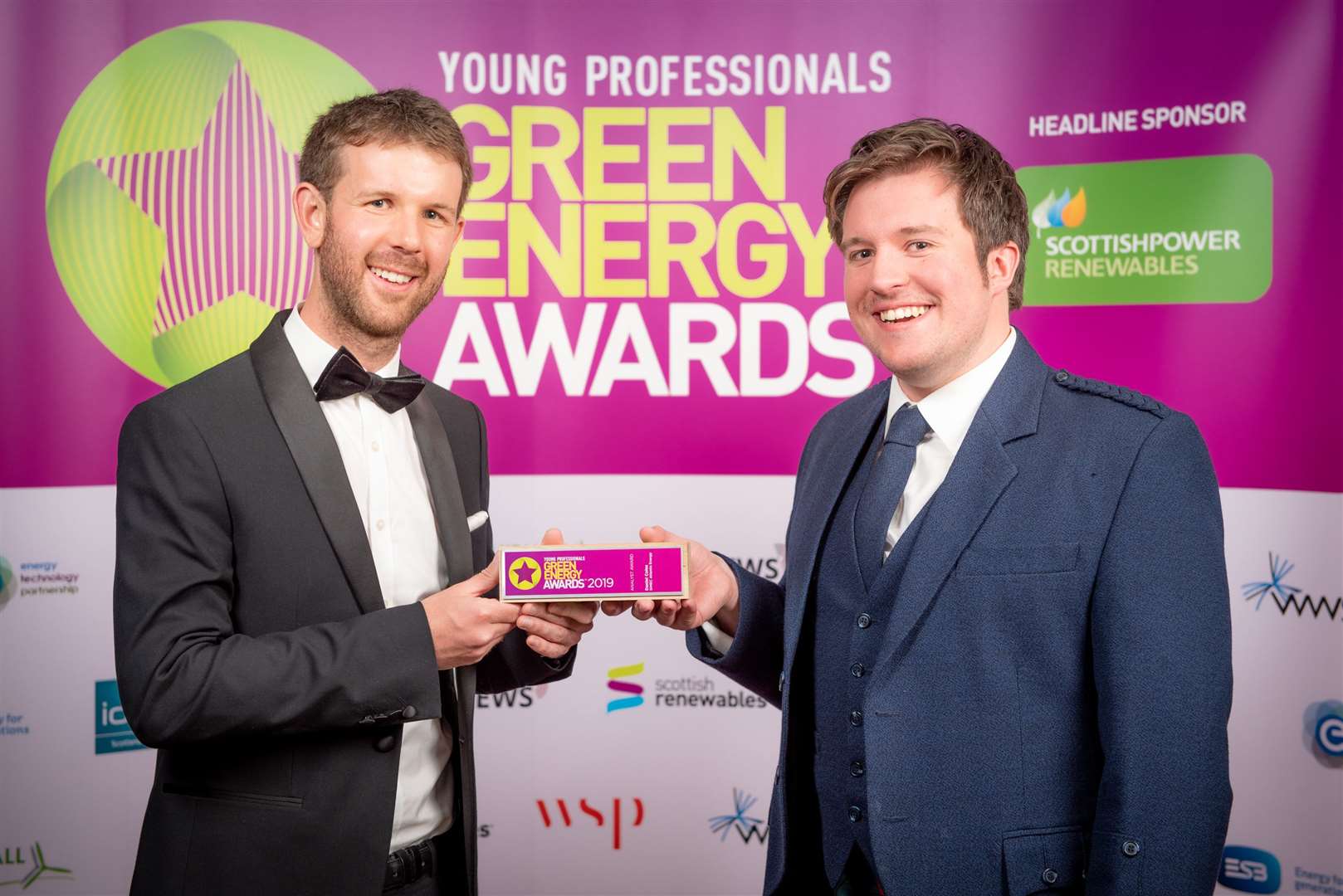 Daniel Coles (left) receiving his award from Stuart Davidson of Arcus Consulting, which sponsored the category.