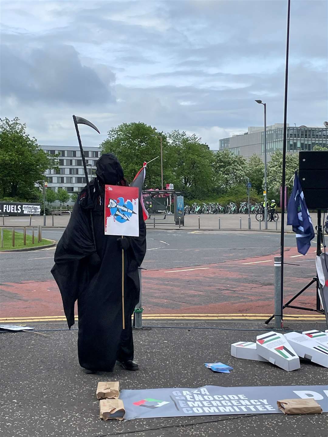 A demonstrator dressed as the Grim Reaper, as protesters gather outside the Barclays AGM at the SEC in Glasgow (Lucinda Cameron/PA)