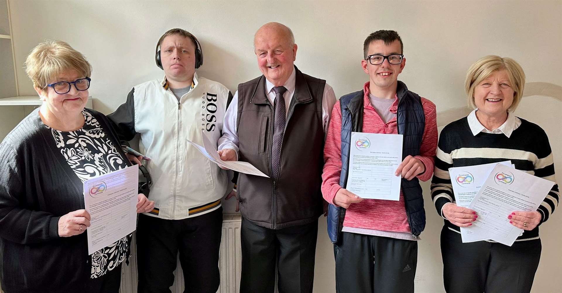 From left: Julie Mackinnon (Wick Youth Club), Tyler Mackay (Encompass Caithness), Councillor Willie Mackay, Conor Buchan (Encompass Caithness) and Councillor Mackay's wife Glynis (also Encompass Caithness) holding copies of the survey.