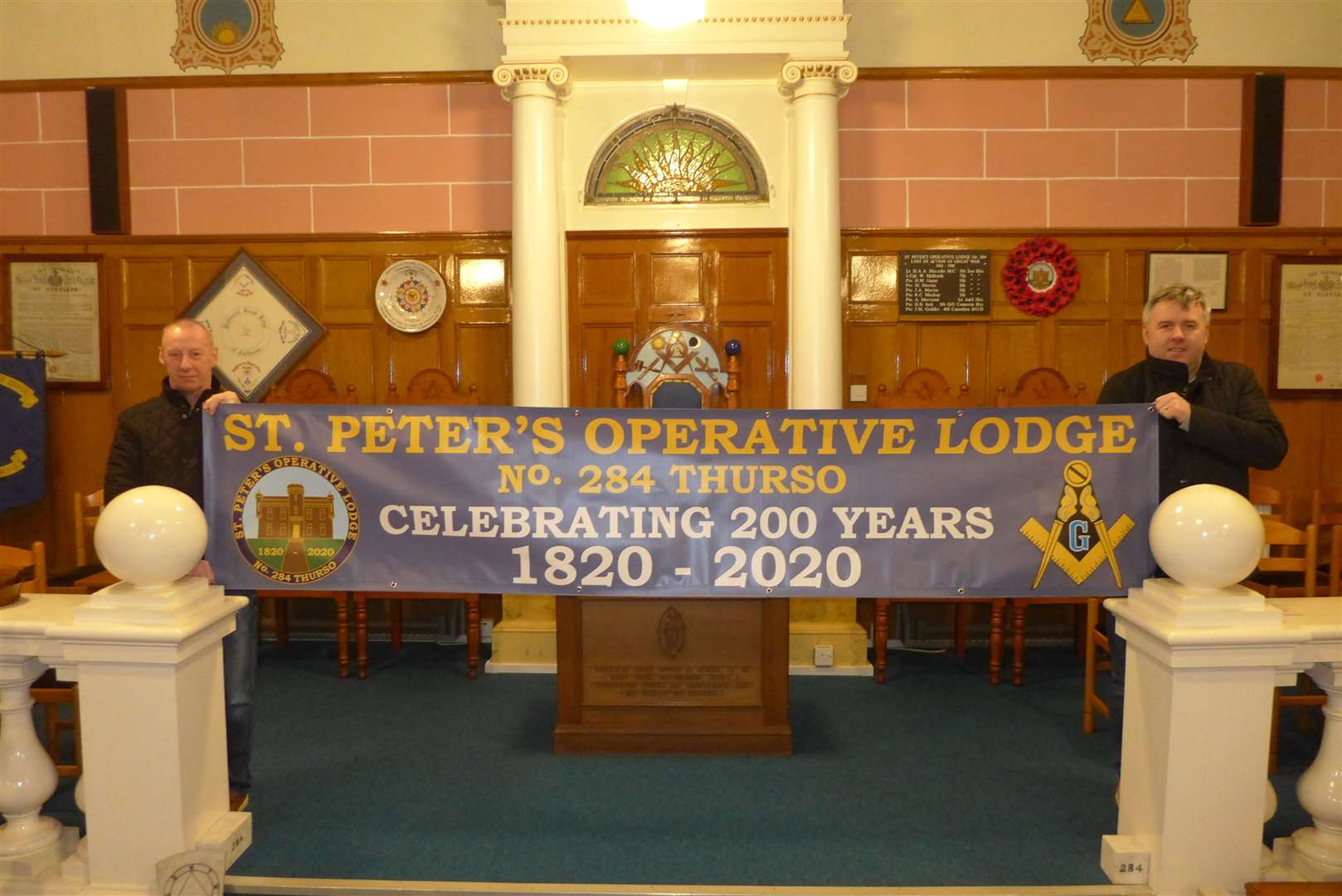 Past Master James Moodie (left )and current Right Worshipful Master William Durrand unveil the banner in preparation for St Peter's Operative Lodge's 200th anniversary celebration. Picture: Willie Mackay