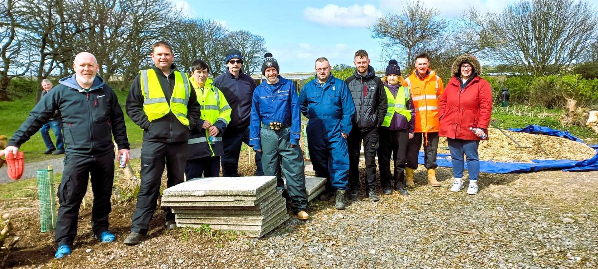 Wick Paths Group volunteers along with Rolls Royce workers helped clear up pathways around Wick riverside and the caravan site.
