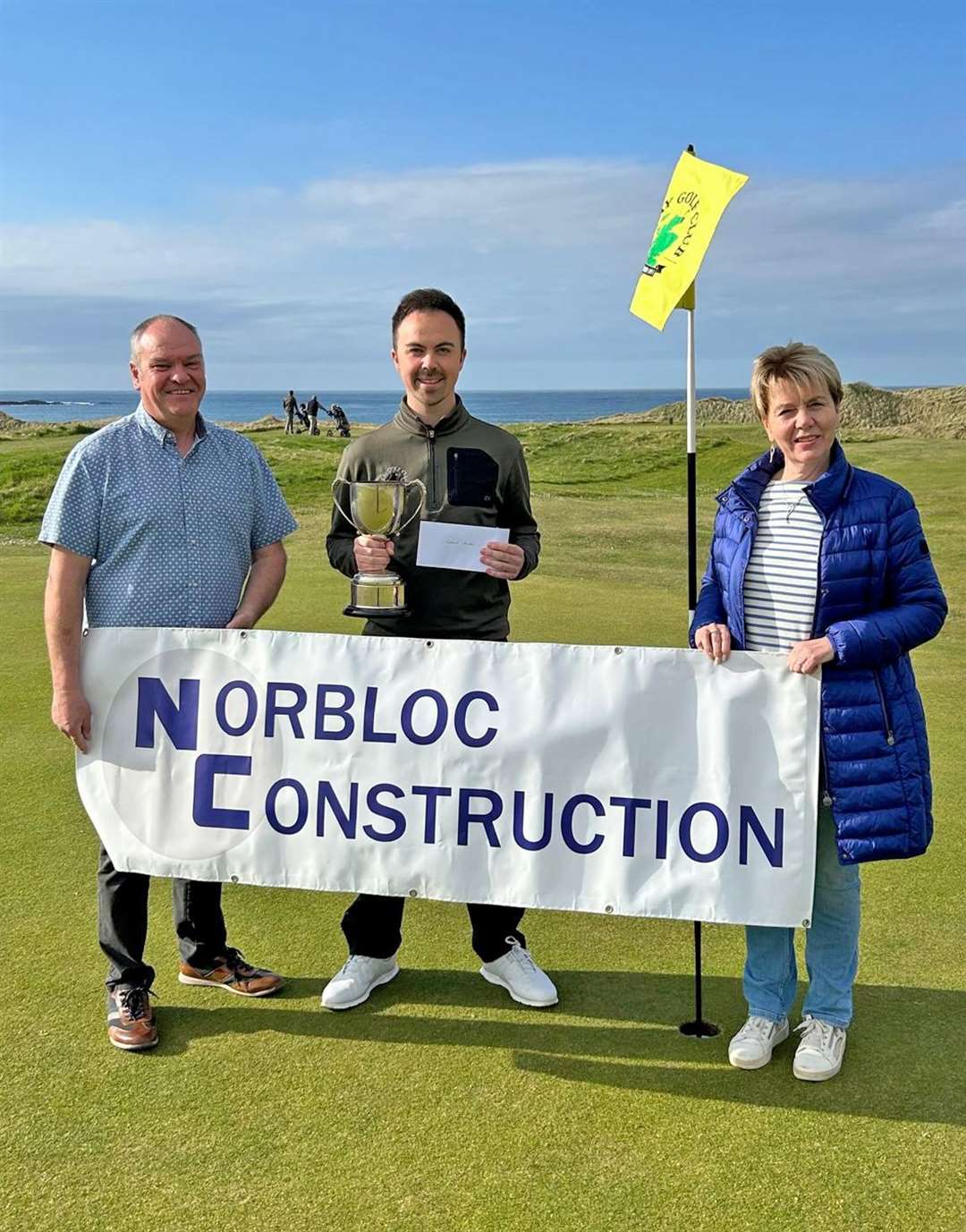 Gregor Munro (centre), scratch winner of the recent Ronnie Wallace Open, with Gavin Sinclair and Trish Bremner of sponsor Norbloc Construction.
