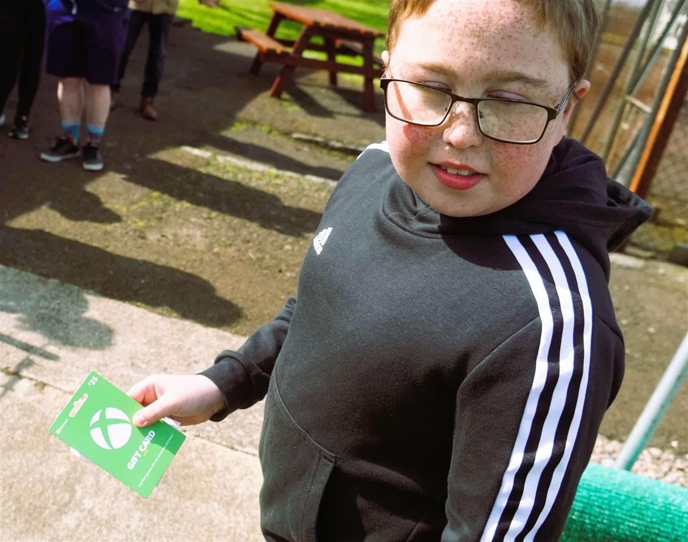 Jamie was delighted to receive an Xbox game card. Picture: DGS