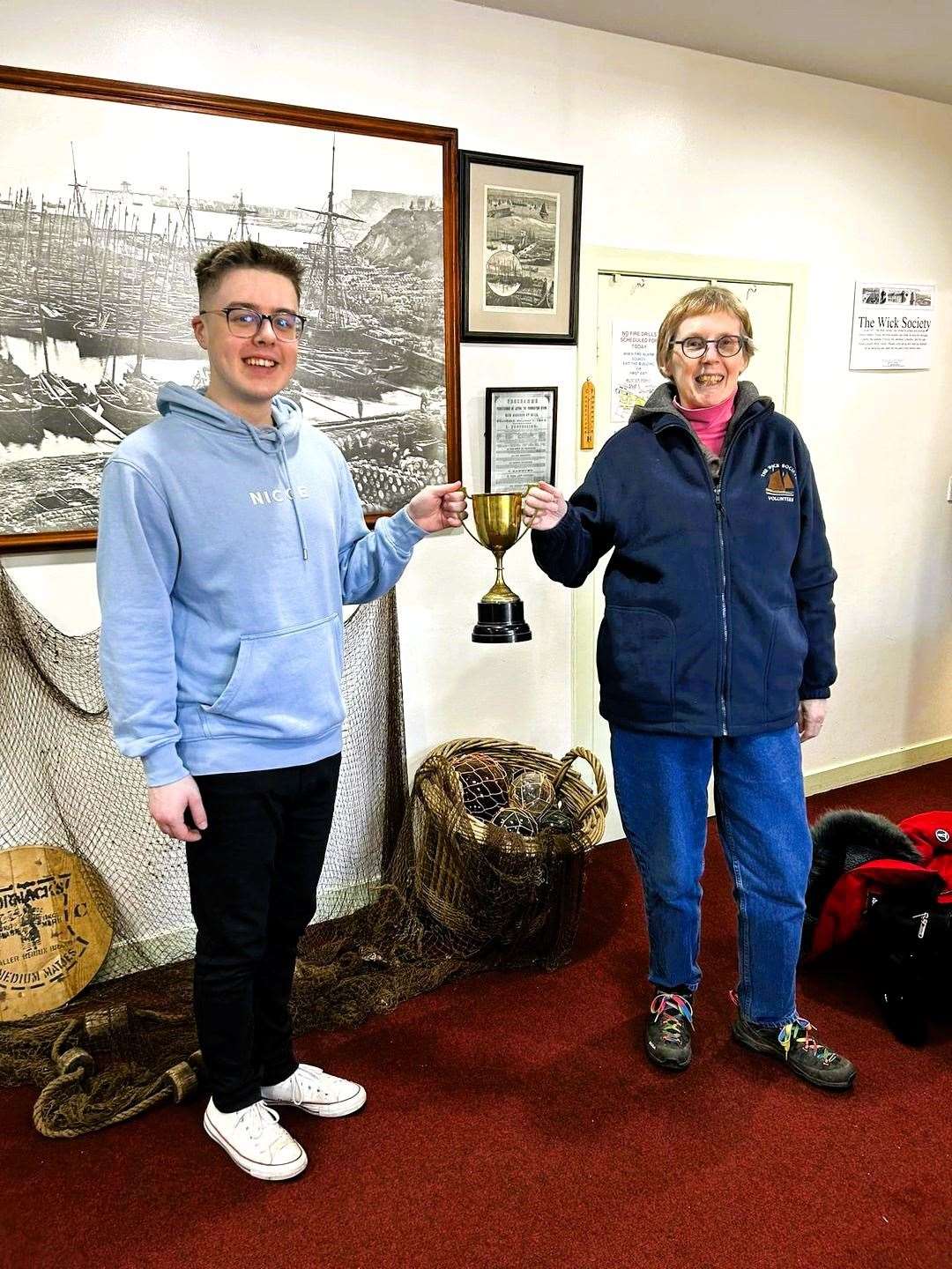 Handover of the Highland Dancing Cup at Wick Heritage Museum. Wick Players secretary, Jayden Alexander gives the trophy to Wick Society member, Margaret Reid. Picture supplied