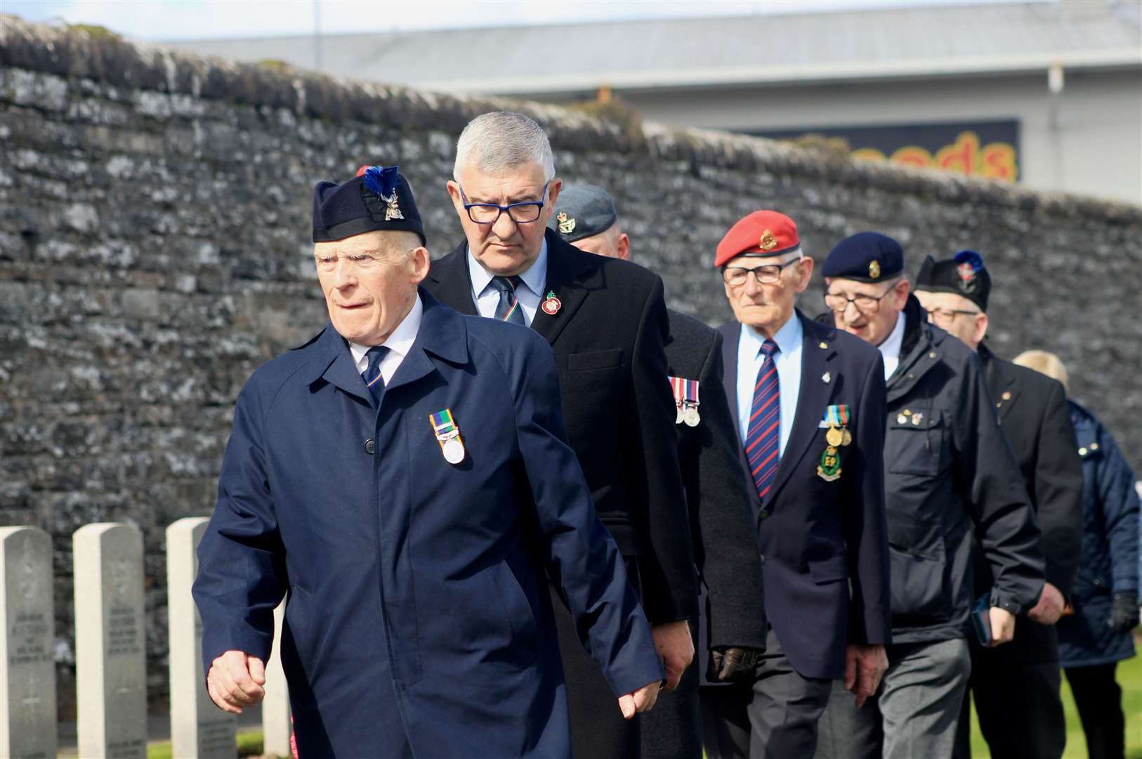 Willie Watt, Vice-Lieutenant of Caithness (second from left), walking to the war graves with Legion chairman Alex Paterson (front) and other members of the Wick, Canisbay and Latheron branch. Picture: Alan Hendry