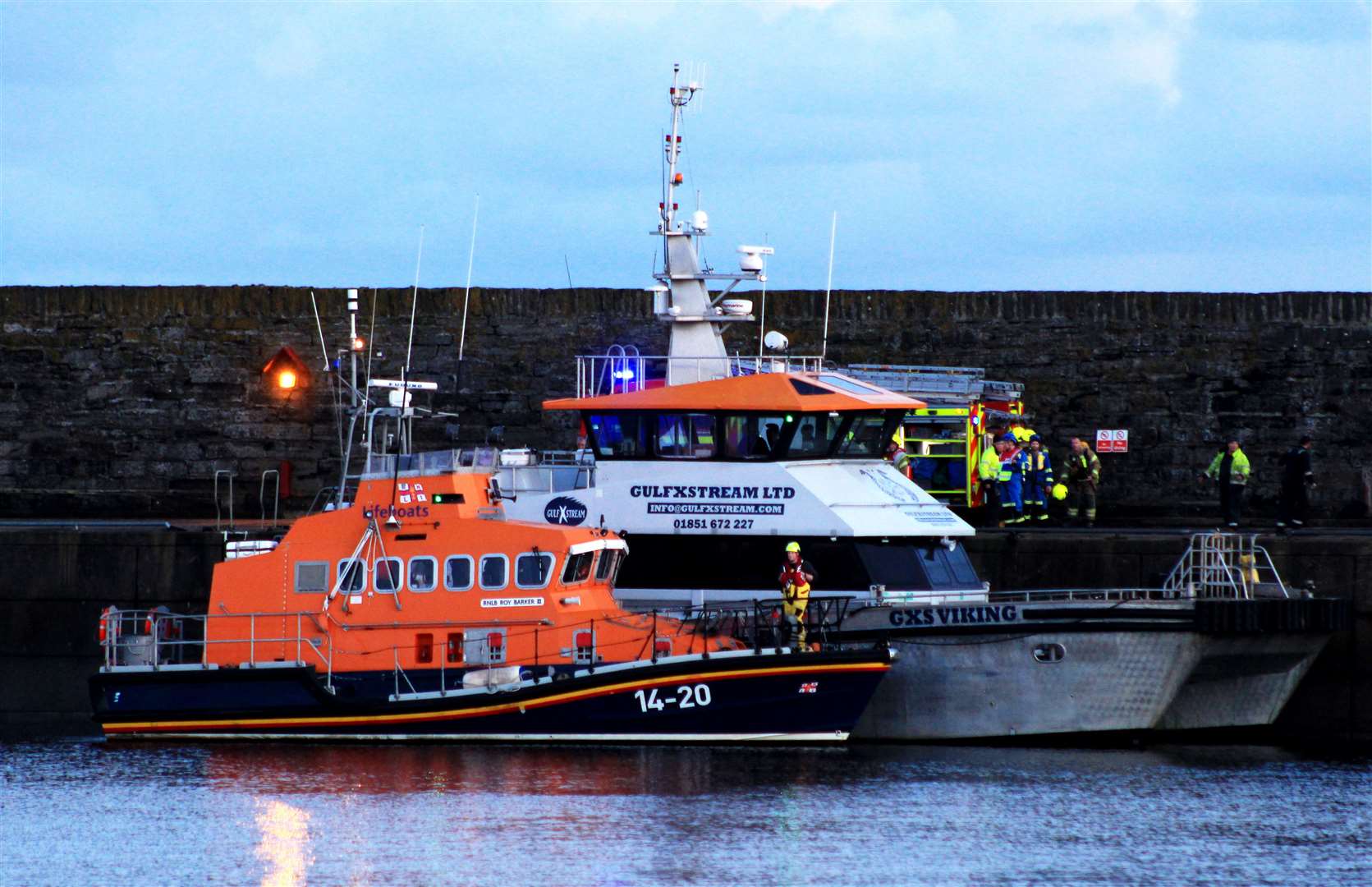 The Wick lifeboat Roy Barker II alongside the vessel shortly after 4pm. Picture: Alan Hendry