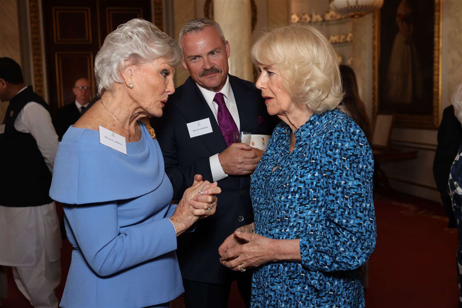 Camilla speaks to Angela Rippon during the reception at Buckingham Palace (Geoff Pugh/Daily Telegraph/PA)