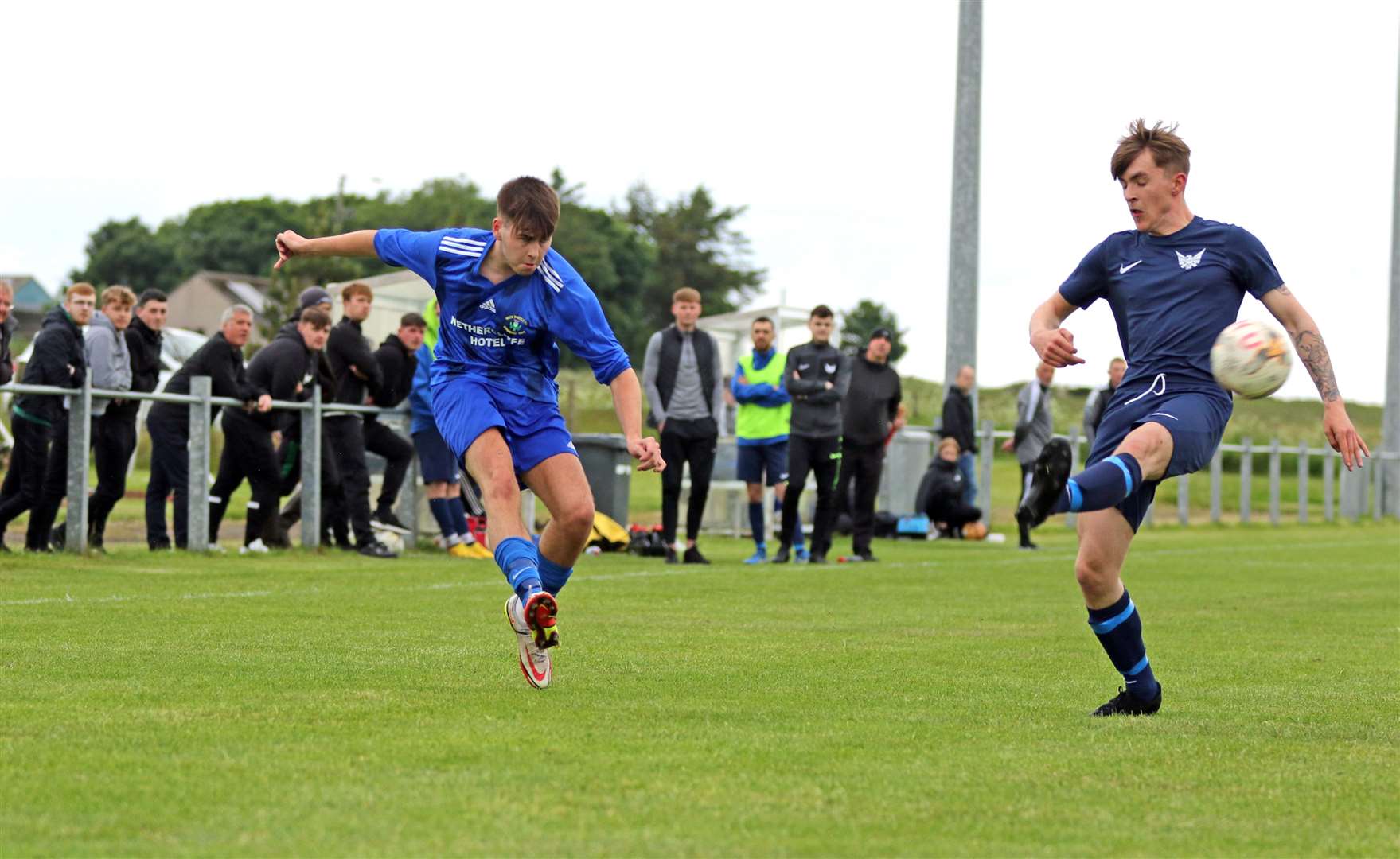 Wick Thistle winger Gary Pullen delivers a cross beyond Grant Mackenzie. Picture: James Gunn