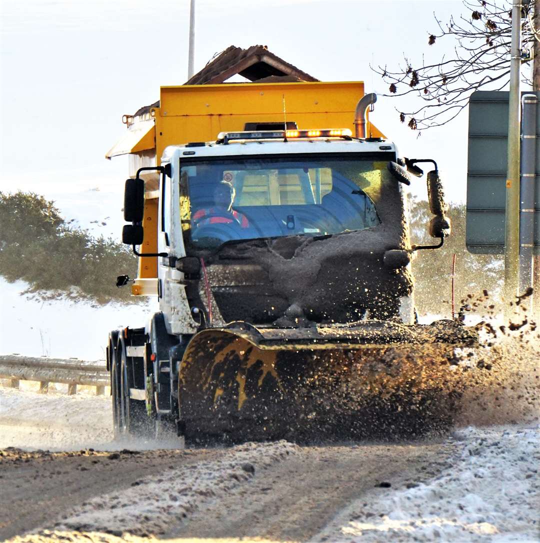 The council's winter maintenance team ploughing its way through the Caithness village of Watten. Picture: DGS