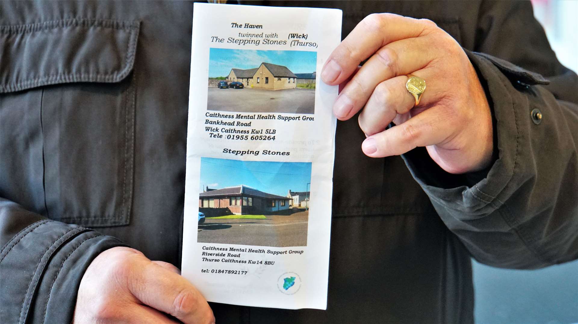 Chris Mackenzie holds a leaflet showing details of the mental health support facilities in Wick and Thurso. Picture: DGS