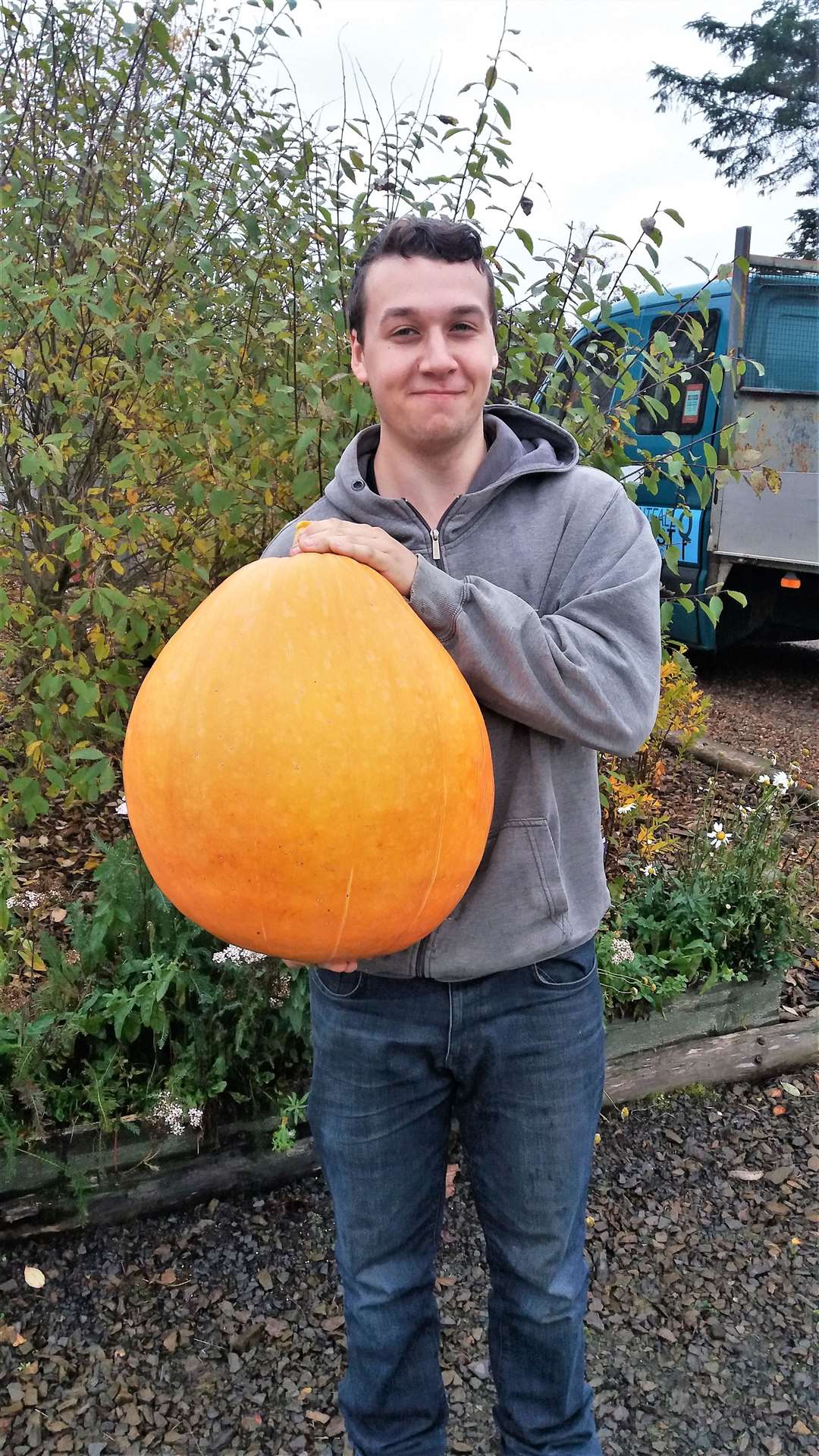 Jay with the pumpkin he grew in a polytunnel at his home in Lyth. Picture: Paul Barrett