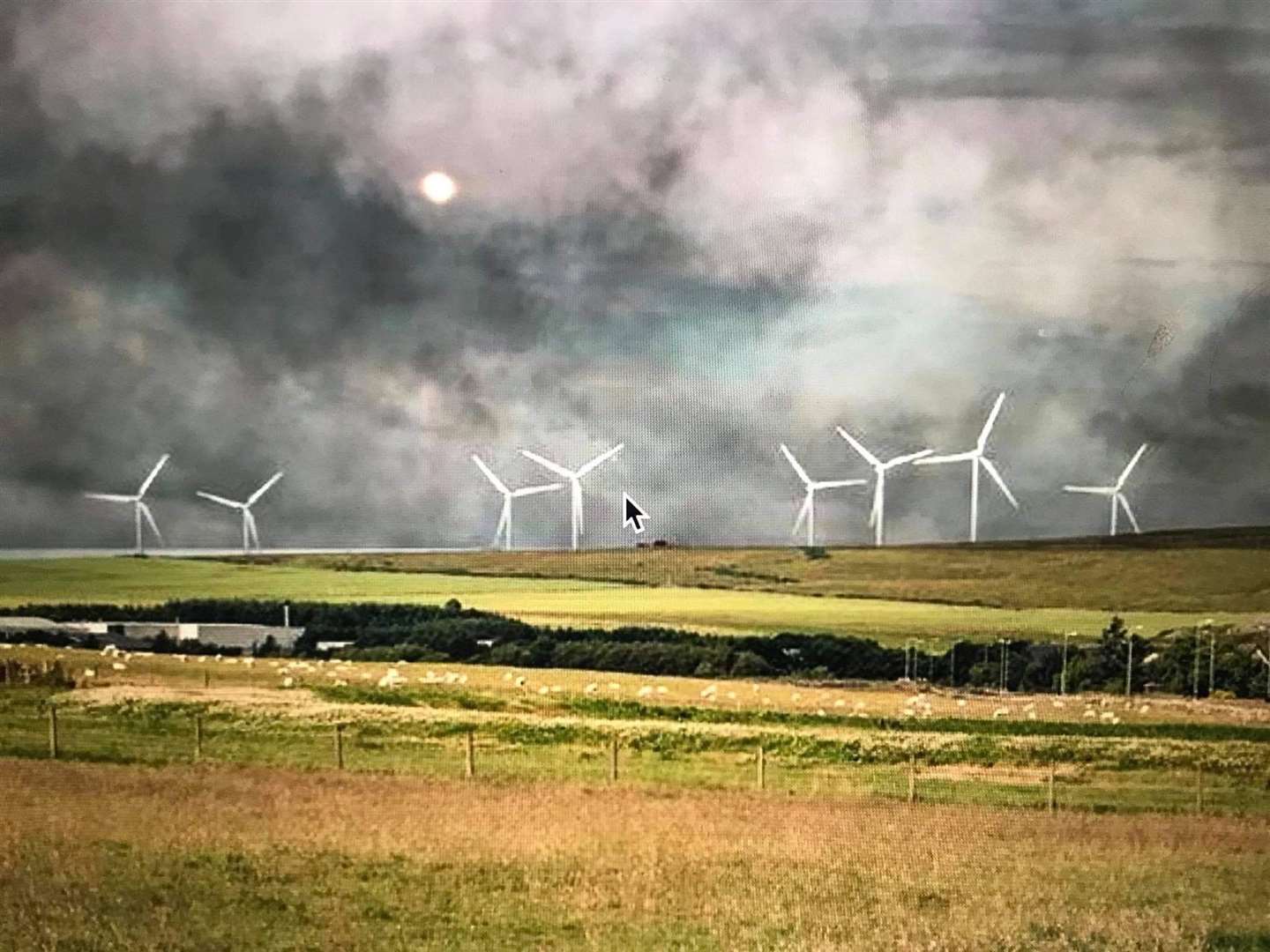 A computerised image shows how the wind turbines could look at the site.
