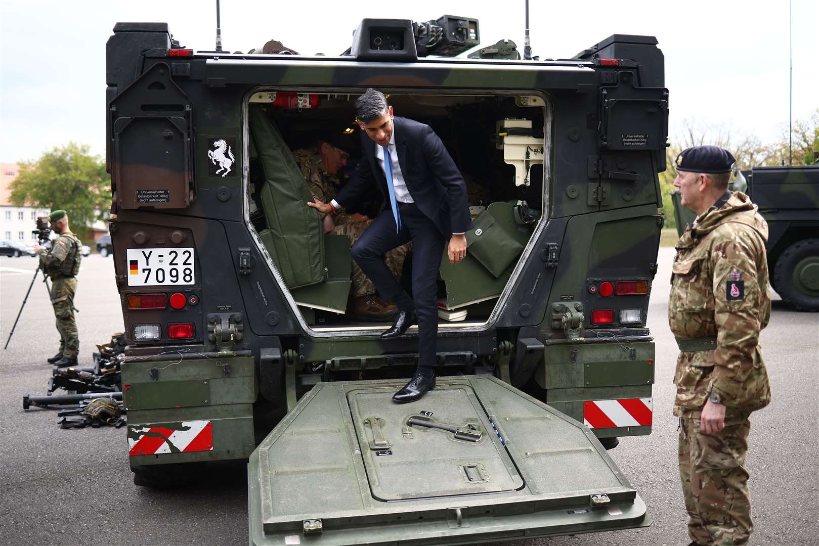 Prime Minister Rishi Sunak disembarks from a Boxer military vehicle (Henry Nicholls/PA)
