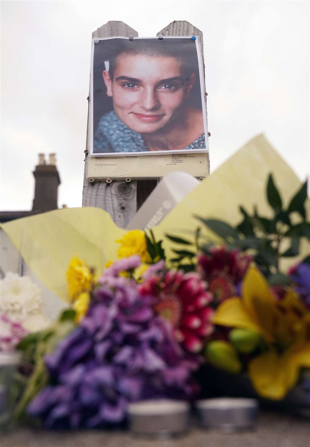 Floral tributes laid outside Sinead O’Connor’s former home in Bray, Co Wicklow (Brian Lawless/PA)