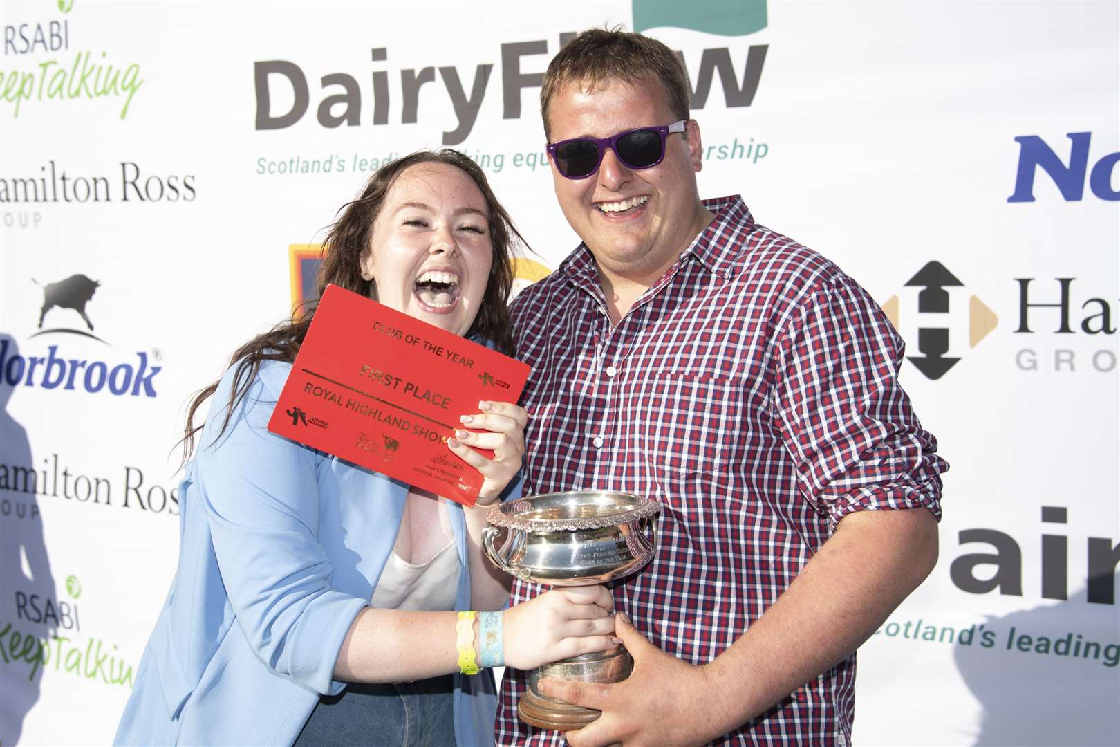 Beth Douglas, secretary, and William Campbell, chairman, collect the National Club of the Year trophy at the Royal Highland Show on behalf of Bower Young Farmers.