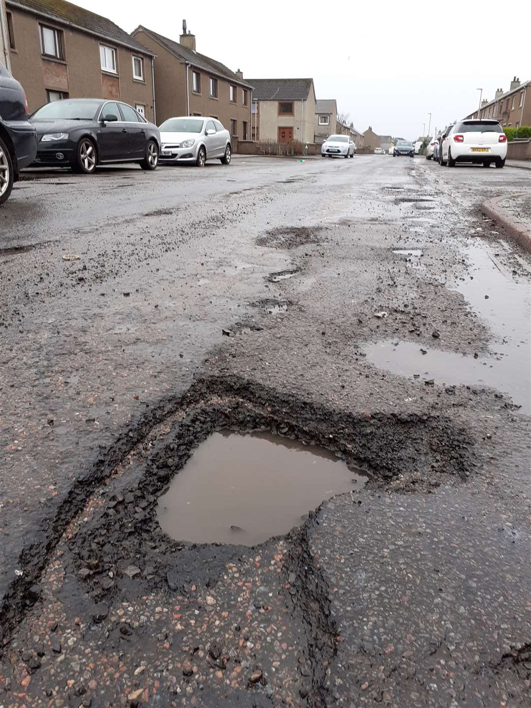 One of many potholes in Wick's Glamis Road, photographed on Saturday. Picture: CRR
