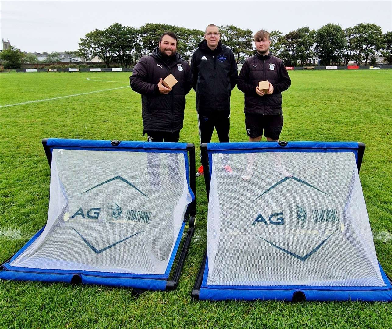 Caley Thistle coaches Lewis Maclean (left) and Craig Shand (right) with Alyn Gunn of AG Coaching.