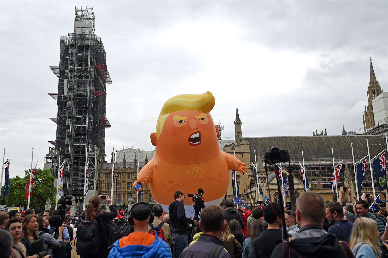 Members of the Baby Trump Balloon team set up in Parliament Square (David Mirzoeff/PA)