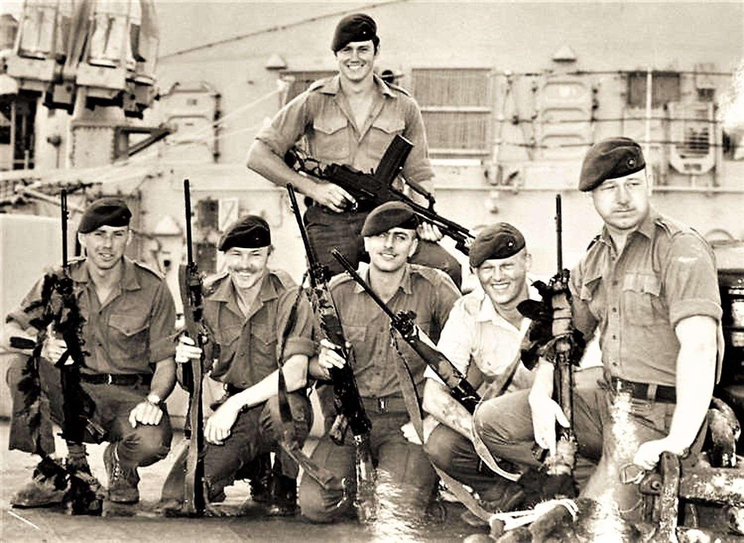 Ronnie is crouching in the middle of this picture taken during the time of the Falklands War and his friend Gerry Watt is on the extreme left. Both were injured during an Argentinian air attack that killed their friend Geordie Davison. The surviving soldiers honoured the memory of their late friend with a Caithness Glass bowl.