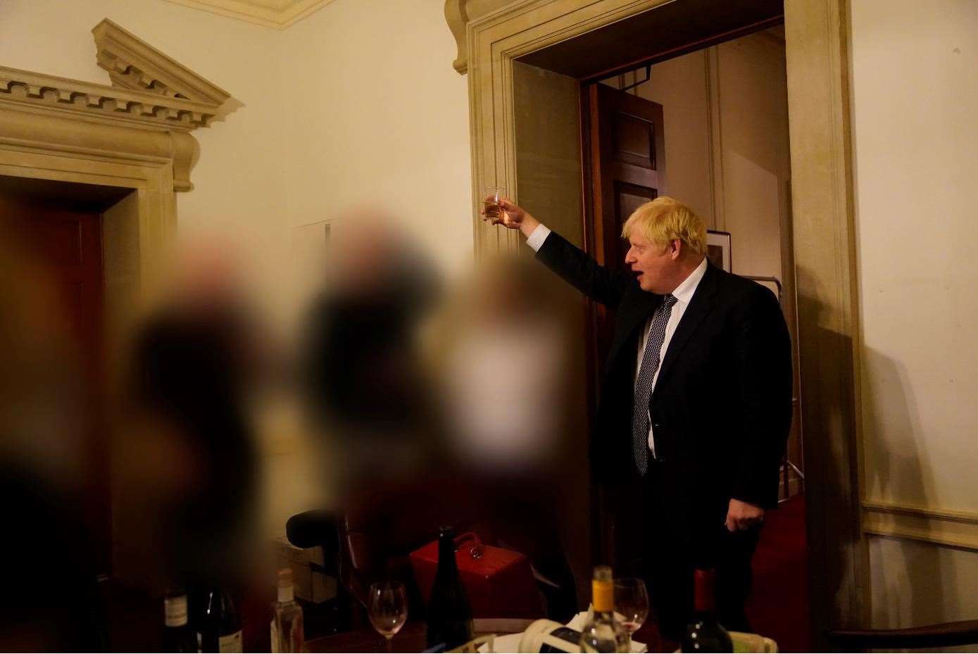 Boris Johnson raises a glass during a No 10 leaving do (Sue Gray Report/Cabinet Office/PA)