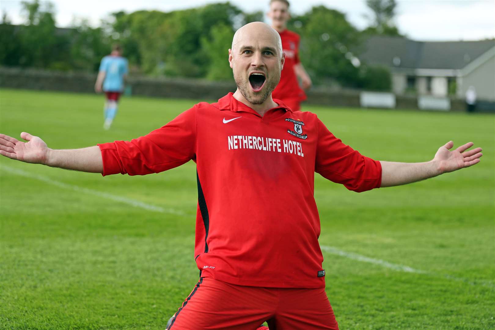 A delighted Sandy Sutherland performs a sliding celebration after Wick Groats' third goal. His side went on to beat Pentland United 5-2 to win the Colin Macleod Memorial Cup final at Castletown. Picture: James Gunn