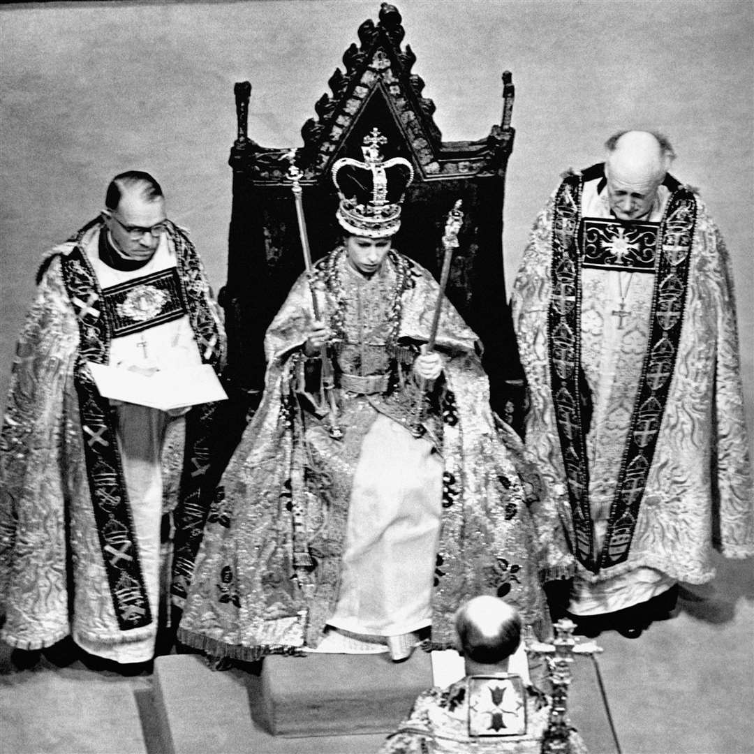 The crowned Queen Elizabeth II on her dais above the Cosmati pavement in 1953 (PA)