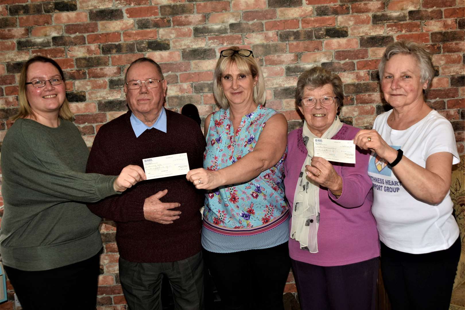 Alistair and Pat Lamont (second left and second right) with Laurandy's Tracy Mackay (left) Alison Robertson along with Caithness Heart Support Group secretary Marge Donaldson (right). Picture: Noel Donaldson
