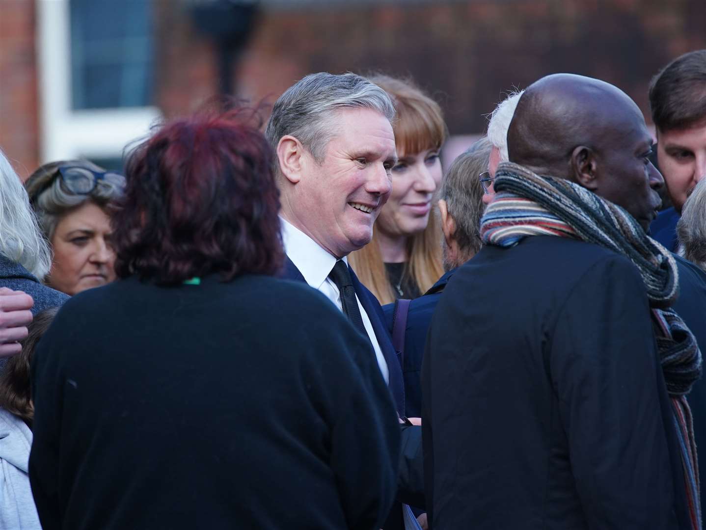Labour leader Sir Keir Starmer talks to guests at the funeral of veteran MP Sir Tony Lloyd (Peter Byrne/PA)