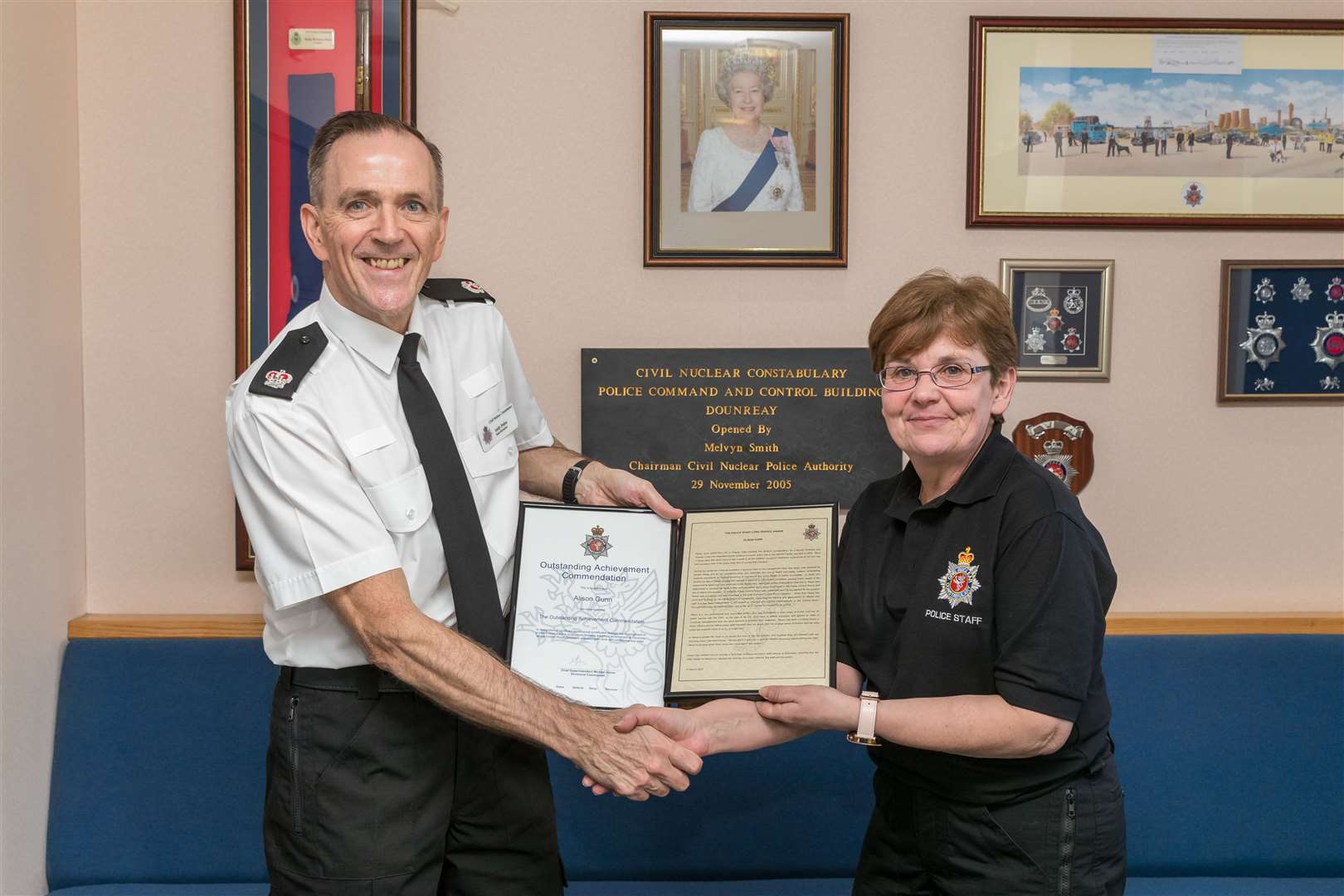 T/Supt Andy Peden, operational unit commander, presents police control room operator Alison Gunn with the police staff long service award and outstanding achievement commendation.