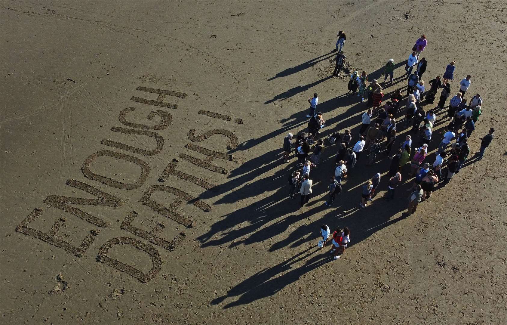 People at a vigil at Sunny Sands Beach in Folkestone for the migrants that died over the weekend (Gareth Fuller/PA)