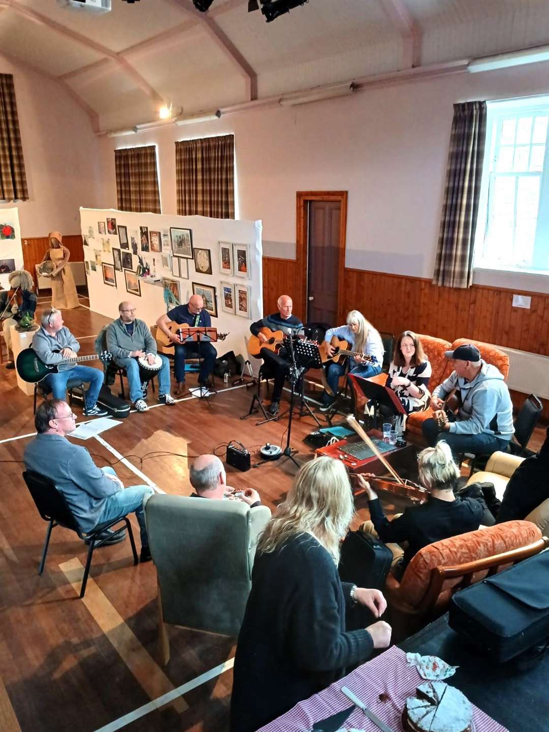 E'shed on Dram and Jam Tour, joined by Addie Harper Jr, Lewis and Eleanor Lee and enthusiastic amateurs. Surrounding them is art from the new exhibition at Halkirk. Picture: Dan Ross