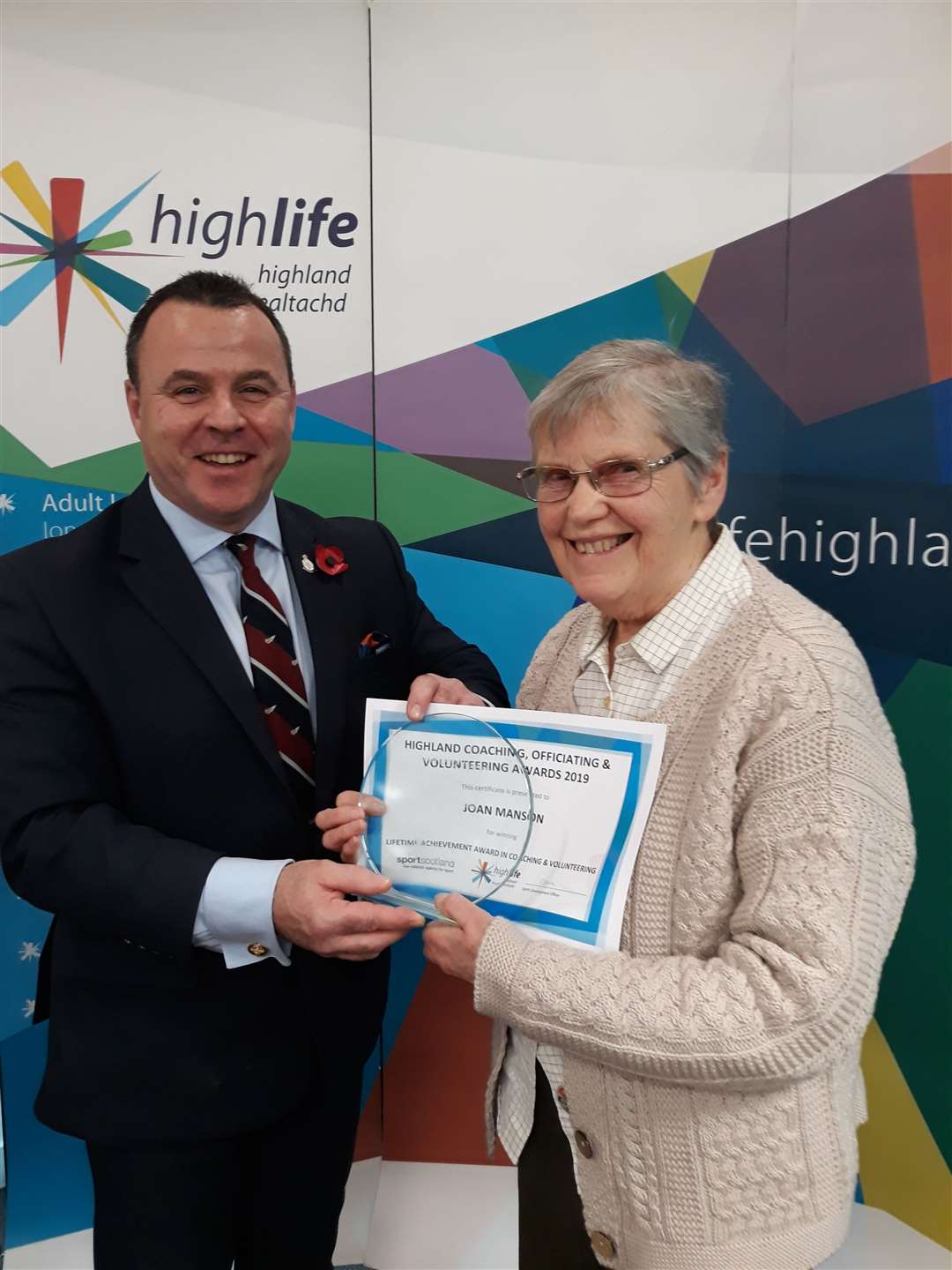 Steve Walsh, chief executive of High Life Highland, presents Joan Manson with her Lifetime Achievement in Coaching and Volunteering award.