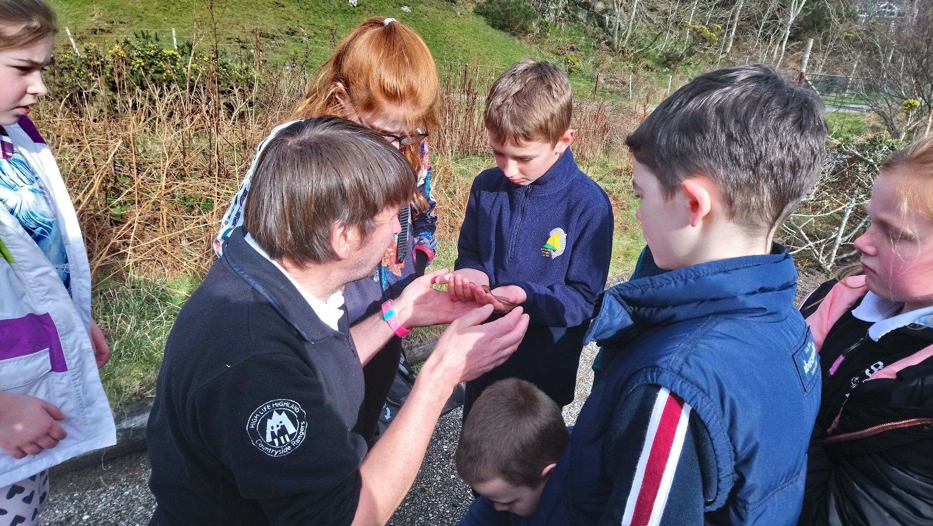 Senior Countryside Ranger for North Highlands Andy Summers with primary school children.