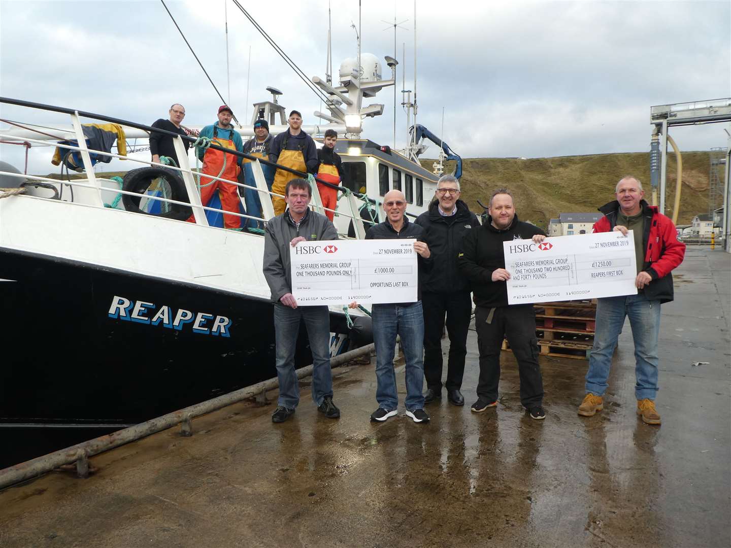 Cheques from local boats Reaper and Opportune are presented to the chairman of the Seafarers Memorial Group, Willie Watt. From left: Darren Norquoy, of Scrabster Seafoods, Graeme Bremner, Bremner Fishing Company, Willie Watt, Reaper skipper Donald Anderson and joint owner Peter Sinclair.