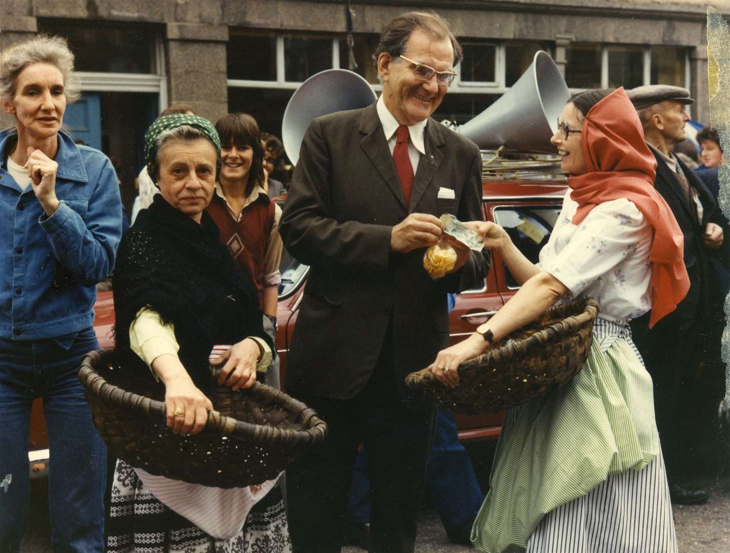 Modern herring gutters Mary Cabrelli (left) and Trudi Mann persuade surgeon Hugh Crum to make a donation towards the proposed Wick swimming pool in 1976. Watching is Groat editor Bette McArdle (left).