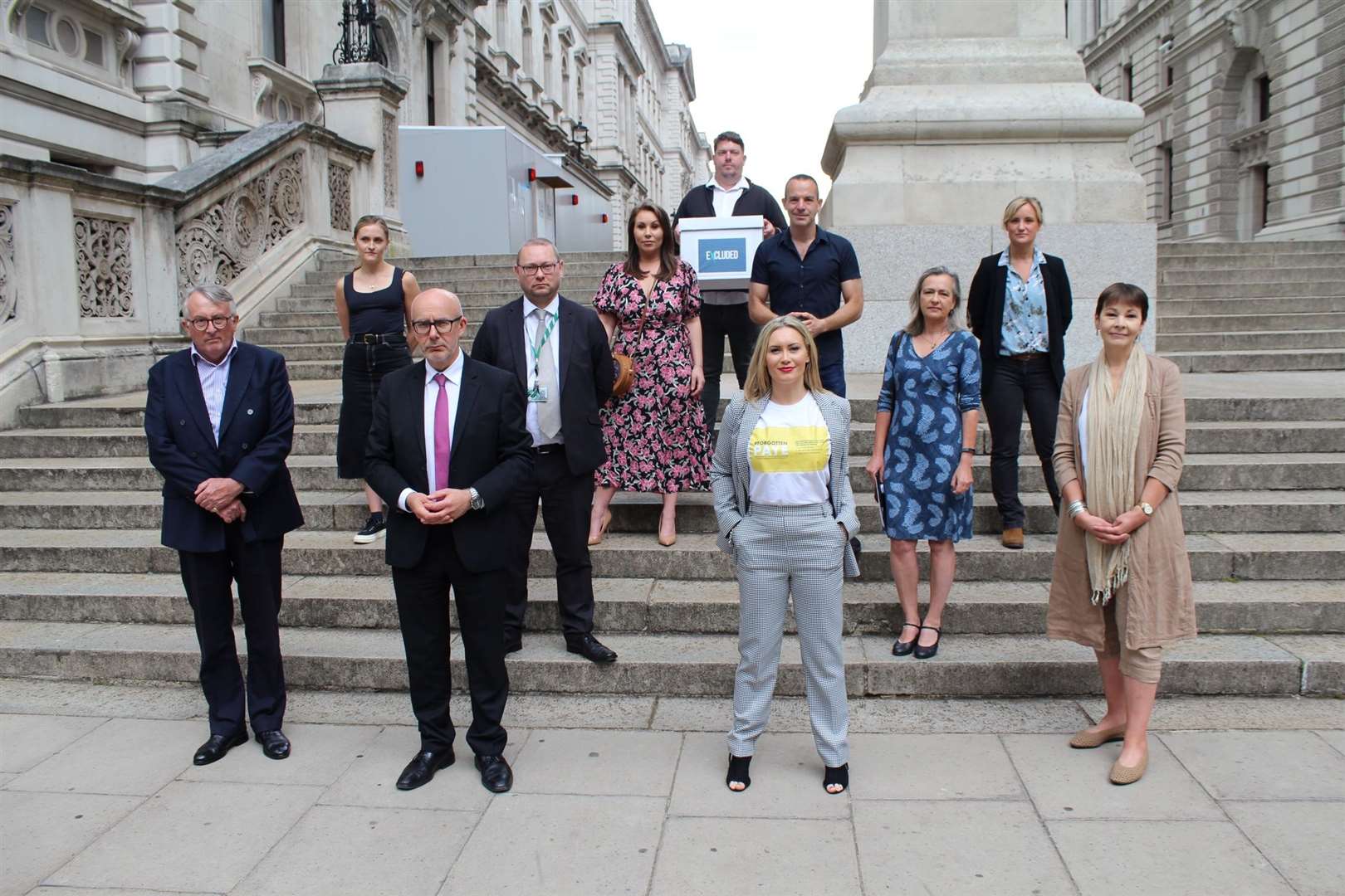 Jamie Stone and members of the ExcludedUK group delivering a petition to the Treasury earlier this month.