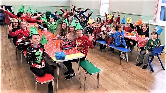 Watten Primary kids wearing hats and ready to have Christmas lunch after their hard work.