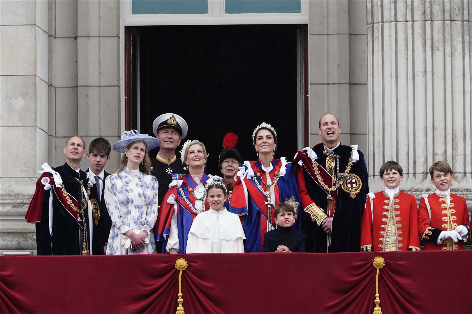 (Left to right) The Duke of Edinburgh, the Earl of Wessex, Lady Louise Windsor, Vice Admiral Timothy Laurence, the Duchess of Edinburgh, Princess Charlotte, the Princess Royal, the Princess of Wales, Prince Louis, the Prince of Wales and the Pages of Honour including Prince George (far right) on the balcony of Buckingham Palace after the coronation (Jordan Pettitt/PA)