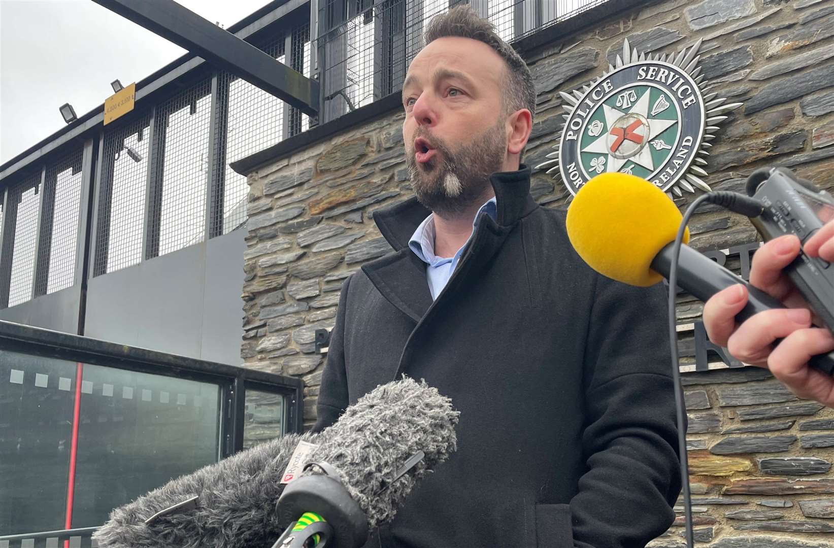 SDLP leader Colum Eastwood spoke to the media outside Strand Road police station in Londonderry in December (Jonathan McCambridge/PA)