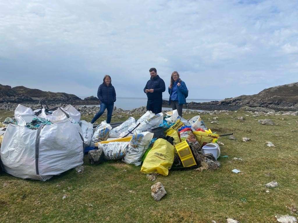 Maree Todd (left) with Juliene and Joan and some of the litter taken from the sea at north west Sutherland