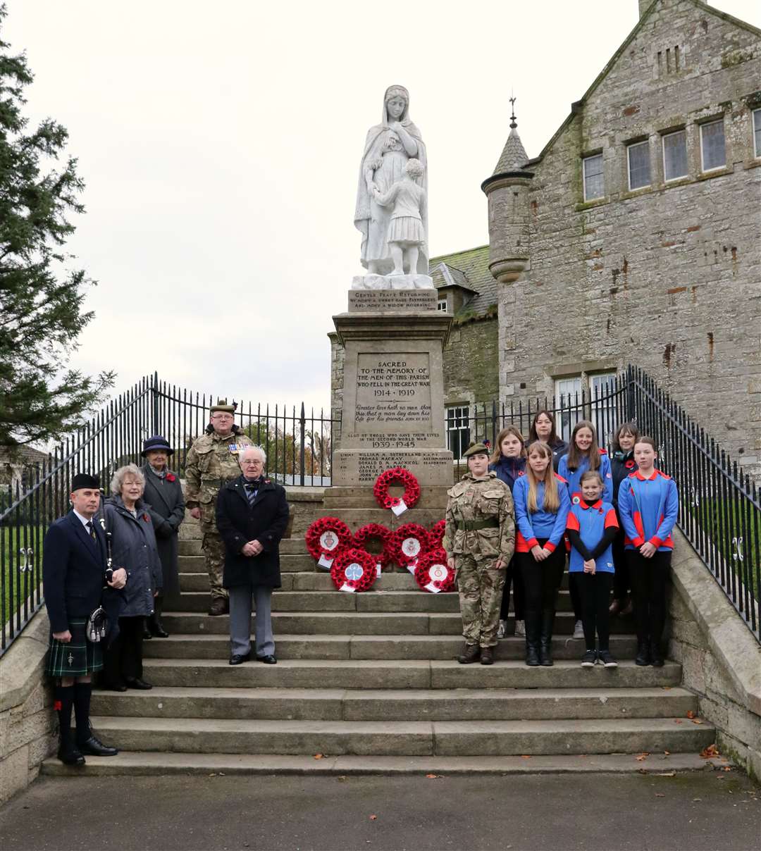 The line-up of the organisations and individuals that laid a wreath at the Halkirk war memorial. The service was taken by Isabel Rennie and the piper was Alan Plowman. Picture: James Gunn