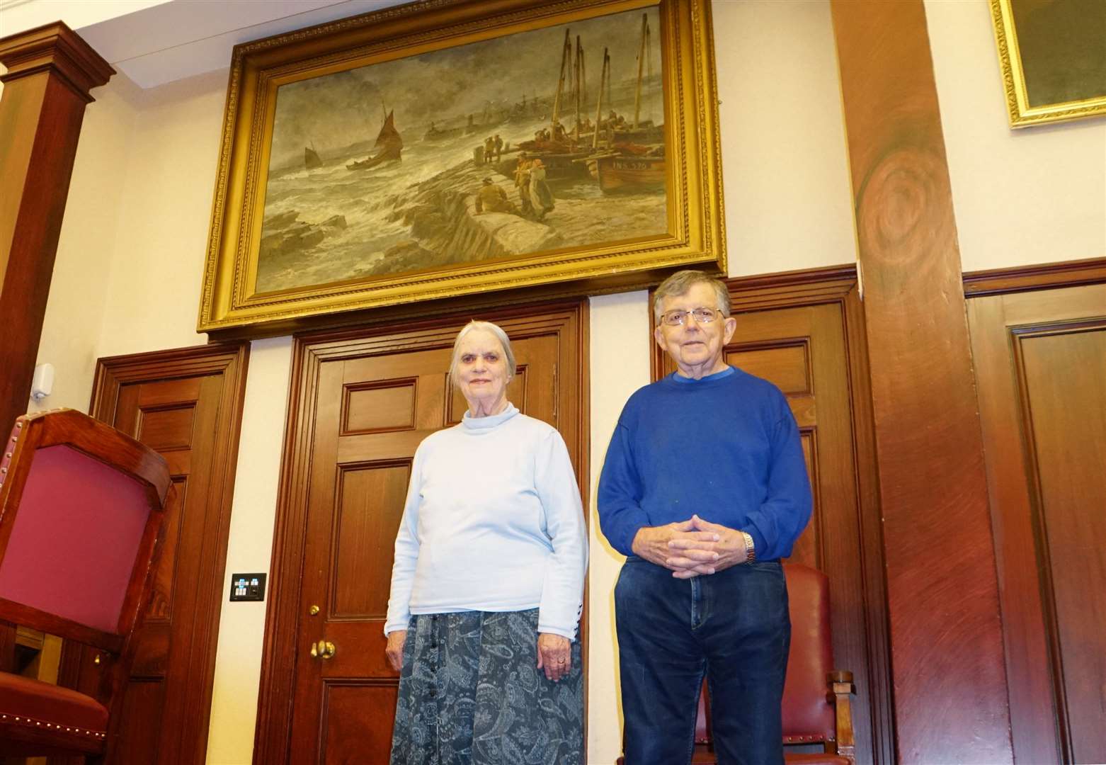 Jenny Chew and her husband Geoff beside the Robert Anderson painting in Wick Town Hall. Jenny is the great granddaughter of the Victorian artist and travelled to Wick in August 2019 to pay tribute to him and the fishermen who died in the Black Saturday tragedy of 1848. Picture: DGS