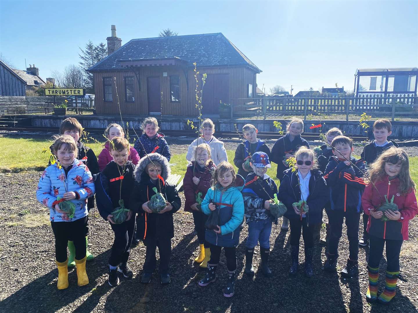 Pupils from P1-4 who were involved in tree-planting in the area around Thrumster's restored railway station.