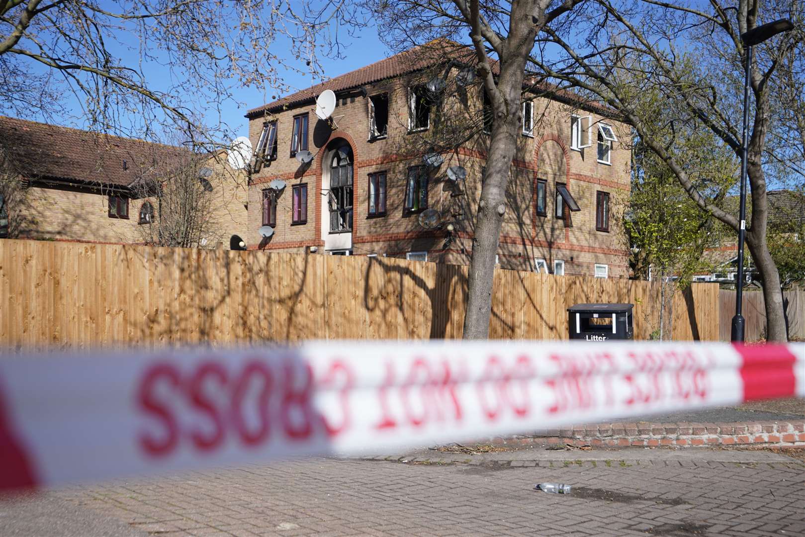 The scene on Tollgate Road in Beckton, Newham after a fire at a block of flats. A man has been arrested on suspicion of murder after one person, believed to be a woman, died in the blaze. Picture date: Friday April 7, 2023.