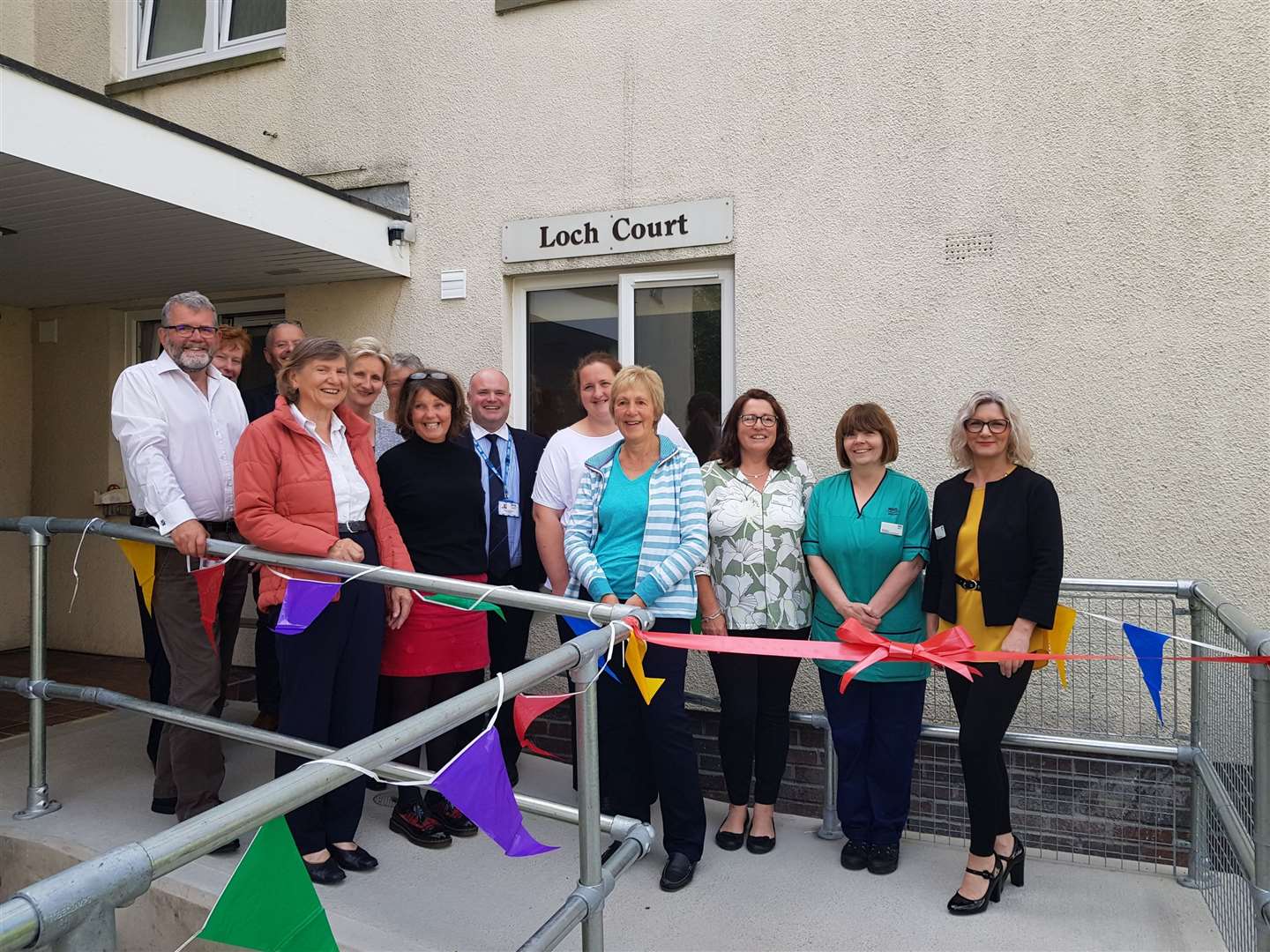 The opening of Loch Court, the new patient accommodation for Raigmore Hospital. Members of the accommodation team are pictured with patients' council members Pat Dobbie (second left), and Linda Burgin (fourth right), along with NHS Highland chief executive Iain Stewart (centre).