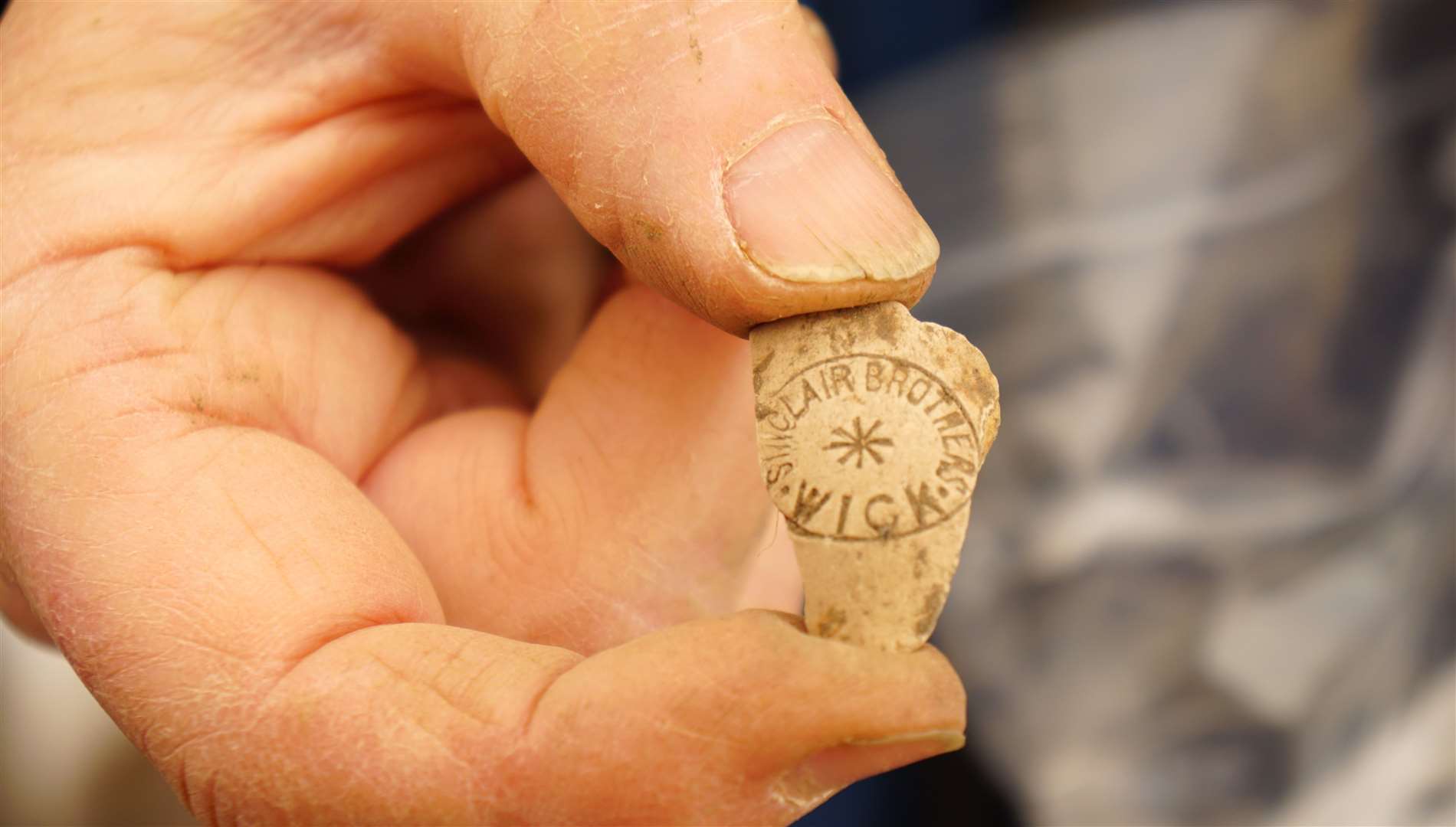 This fragment of a clay pipe is stamped with the name 'Sinclair Brothers. Wick' which is assumed to be the shop where the item was originally purchased. Picture: DGS
