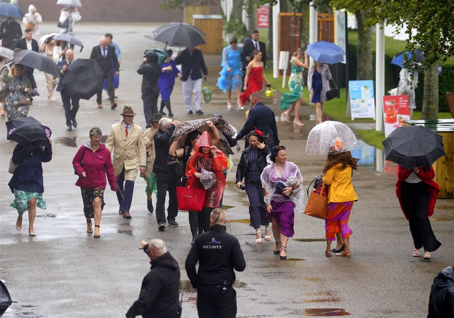 Brollies were much in evidence at the races (Andrew Matthews/PA)