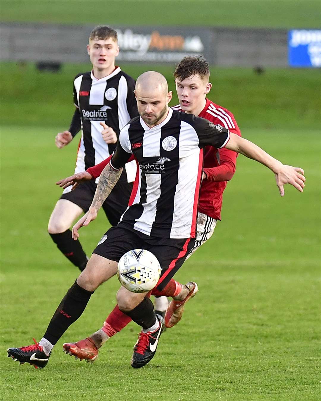 Wick Academy 2 v Deveronvale 1 - SHFL - Harmsworth Park - 05/11/2022 Wick's Sean Munro shields ball from Deveronvale's Matt Jamieson