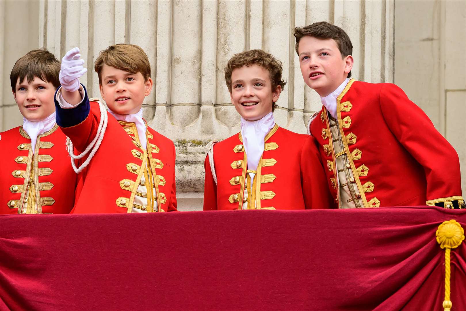 (left to right) Pages of Honour Lord Oliver Cholmondeley, Prince George, Nicholas Barclay and Ralph Tollemache on the balcony of Buckingham Palace after the coronation (Leon Neal/PA)