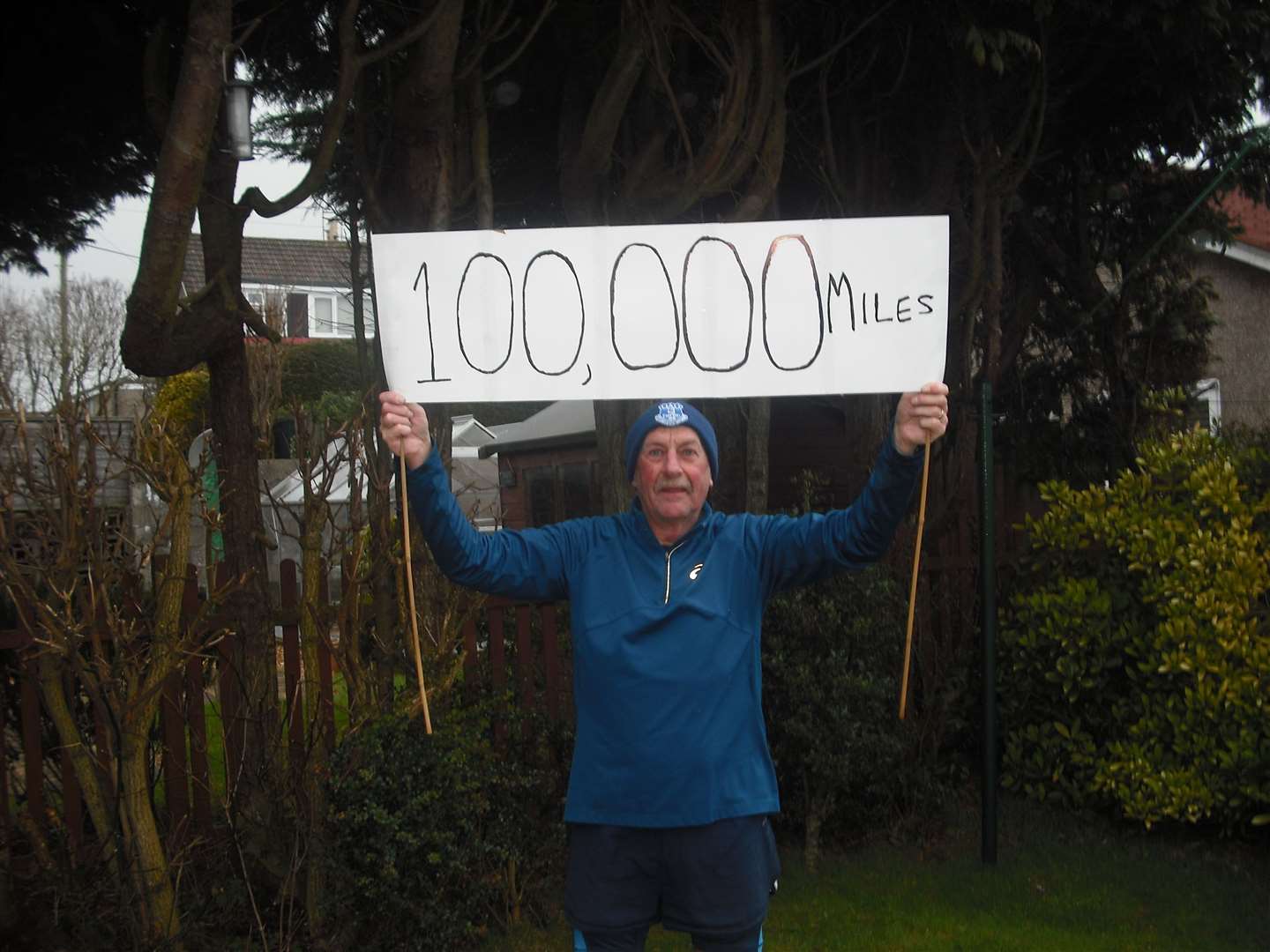 Stephen Cassells celebrates his completion of 100,000 miles running.